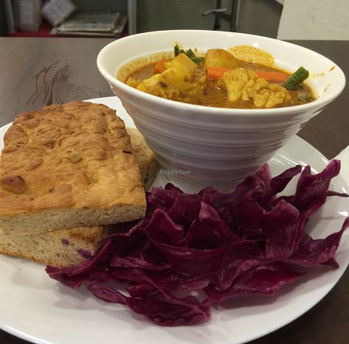 Curry with red carrot chips and home made bread at Well Dressed Salad Bar and Cafe in Central Singapore