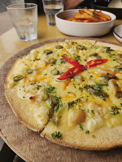 Vegan Jalapeño Pizza on GF Crust and The BEST fries on Earth. at Cabana  in Pauanui