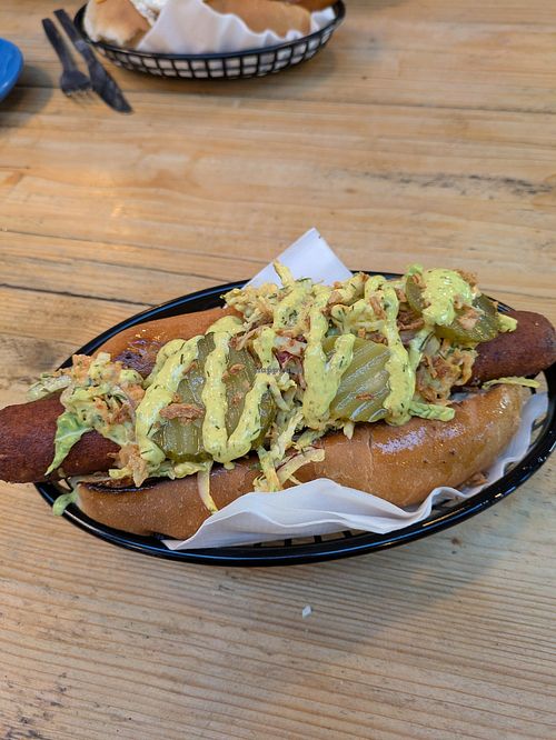 The Great Dane- Moving Mountains hotdog, crispy onions, gherkins, vegan mayonnaise. at Hungry Dogs in Telford