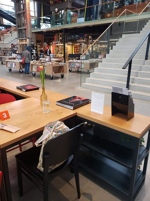 Cafe in library in former train repair warehouse at StadsCafé LocHal in Tilburg