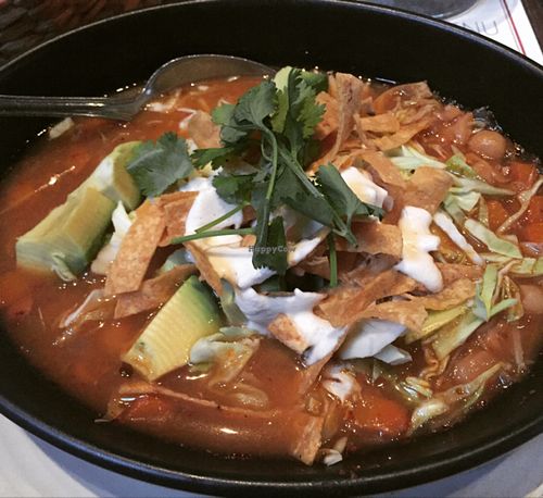 Pozole - hominy stew with red chile base, avocado, tortilla strips, cashew cream, shredded cabbage and cilantro  at Gracias Madre - WeHo in West Hollywood