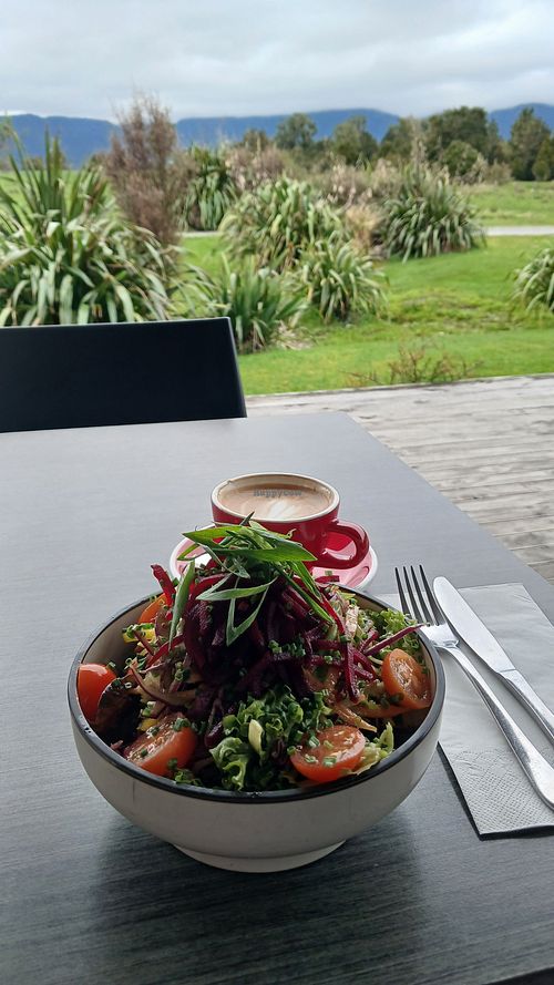 Garden salad and flat white with oat milk at Matheson Cafe  in Fox Glacier
