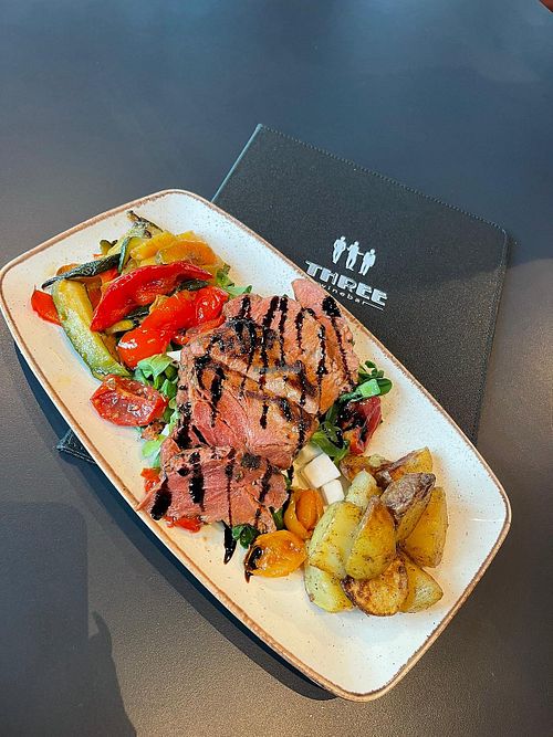 Planted Steak served over roasted veg at Three Winebar in Bolzano