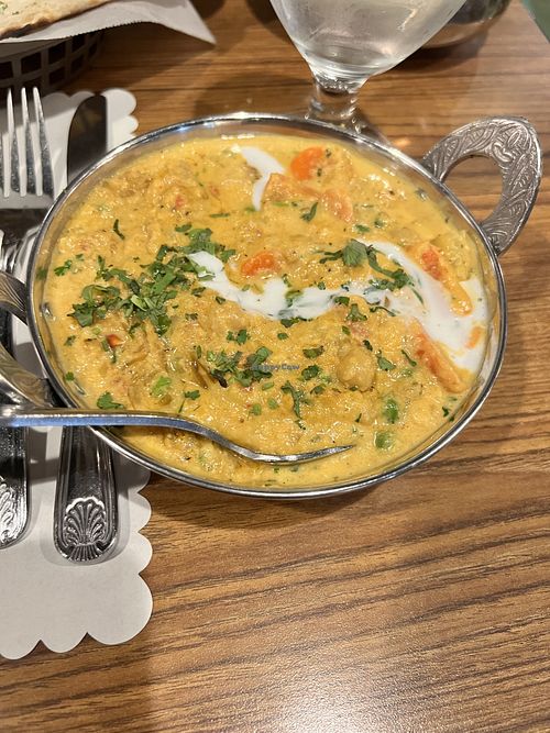Vegetable coconut kurma and garlic naan 🤩  at Bombay Palace in Murray