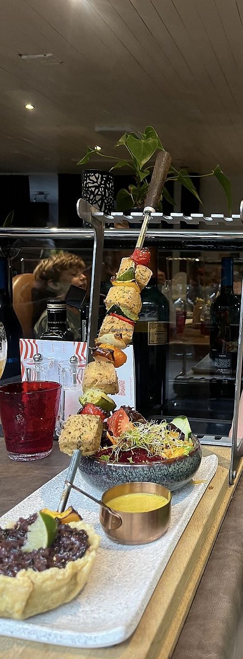 Tofu skewer with salad, vegan curry sauce and rice   at La Ferme  in Zinal