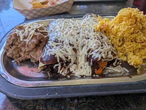 Vegan enchiladas combo with pinto beans & rice, with the $3 extra cheese. at Salena's in Rochester