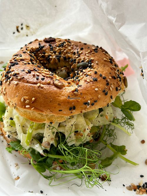Bagel with vegan slaw filling--delicious mix of walnut, dill, apple, fennel & jalapeño mayonnaise. at The Sleeper Store  in St Leonards