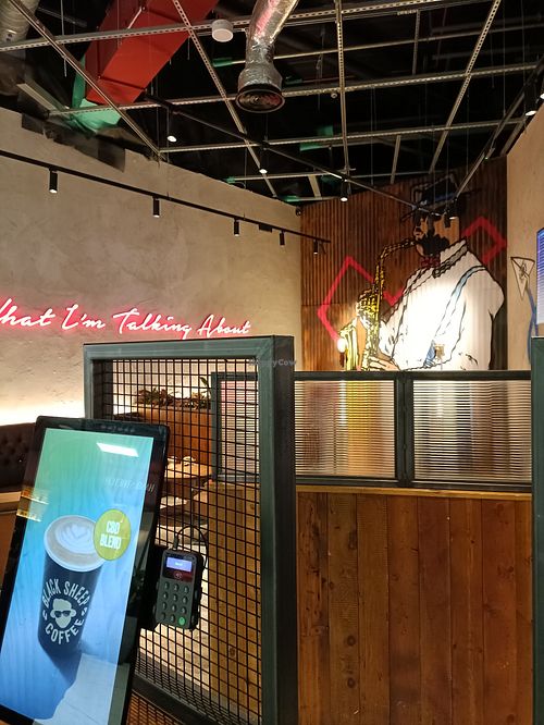 Seating area and ordering station at LTN - Black Sheep Coffee  in Luton
