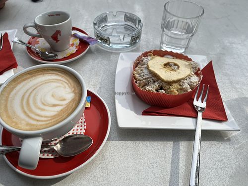 Cappuccino with oat milk (soy milk also available) with apple "sbrisolona”  at Konditorei Cafe Heini in Bolzano