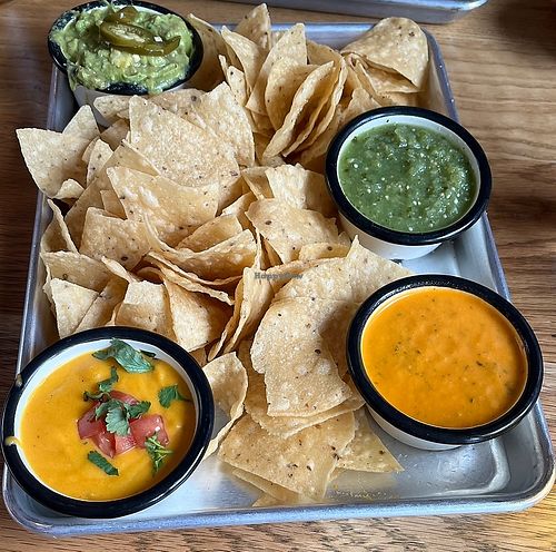 Chips and vegan queso, guac, and salsas  at Lonesome Rose - Andersonville in Chicago