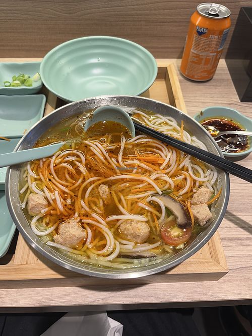 Vegan soup after ingredients are mixed in (with optional chili sauce)  at Jardín de Yunnan  in Sevilla