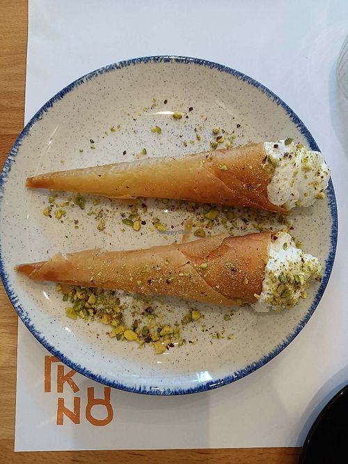 The waitress gave us these for free, pistachio cream inside, so good. at GNOU in Athens