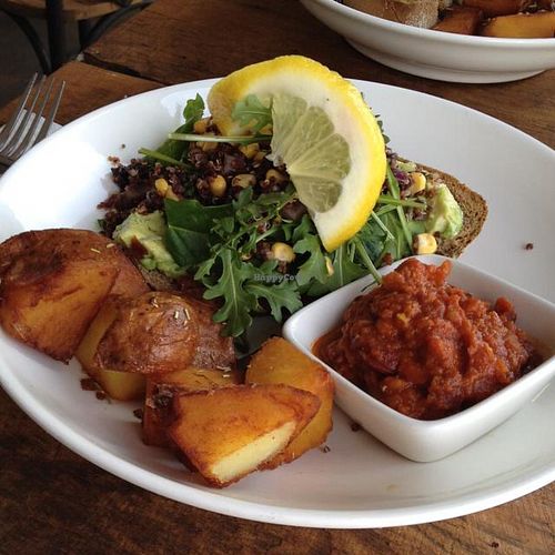 smash avocado with black bean & corn with spiced beans & rosemary seasons potatoes  at Greenhouse Factory in Coolangatta