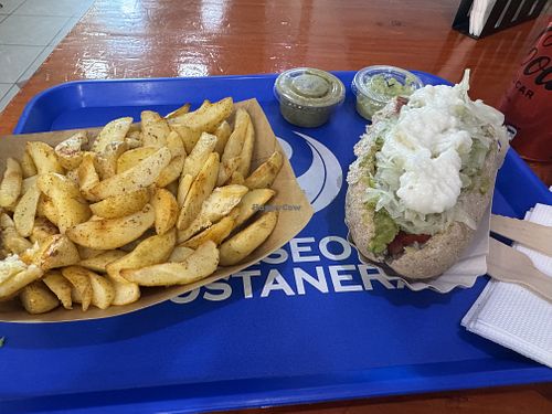 Completo tradicional + Papas Rústicas  at Dharma in Puerto Montt