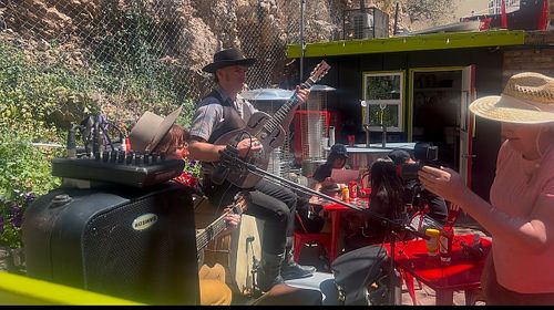 Live music playing in outdoor seating area  at Bisbee Badassery  in Bisbee