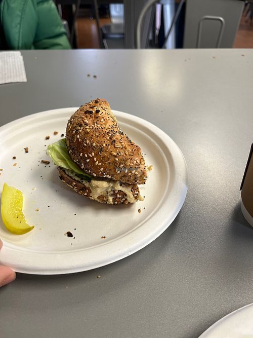 Half of a hummus, lettuce, and tomato on everything bagel.  at Cafe Fresh Bagel in Needham Heights
