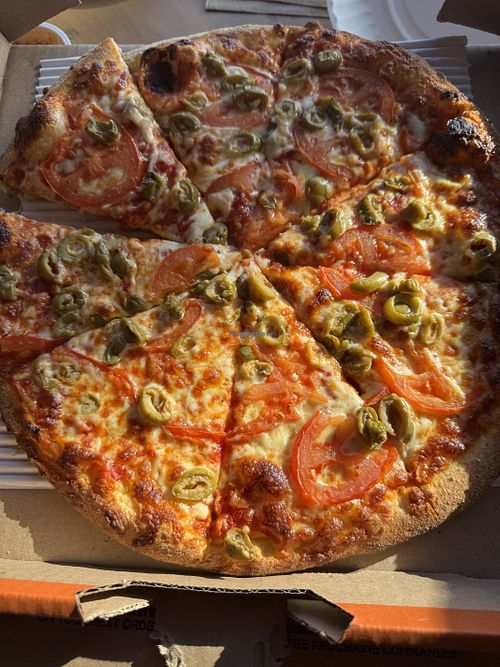 Tomatoes and Green Olives on a pizza   at Pizza Pizza in Mississauga
