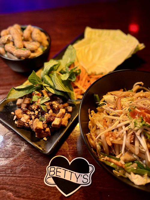 Curry boiled peanuts, cabbage wraps, udon noodles  at Betty's in Pensacola