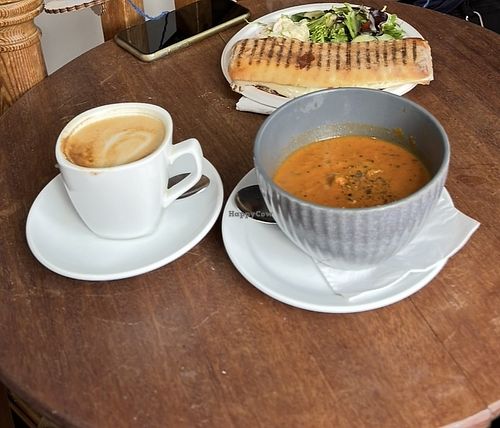 Oat flat white, soup of the day & panini   at Indigo Cafe in Cambridge