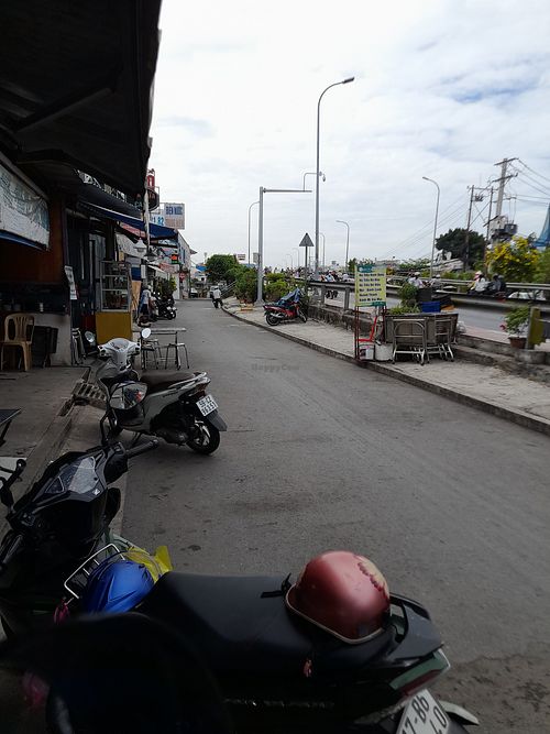 Looking out to the busy road bridge at Hủ Tiếu Chay Âu Lạc Q7 in Ho Chi Minh City
