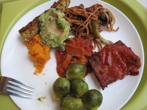 Buffet plate with Brussels sprouts, BBQ tofu, Thai seitan, garlic spaghetti, avocado, veggie pâté and mashed sweet potatoes. It was very good. at Resto Vego - McGill College in Montreal