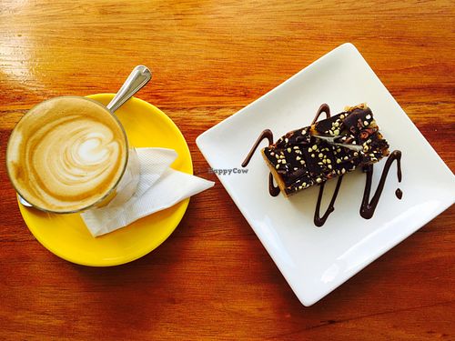 salted caramel slice and soy latte  at Bliss Organic Garden Cafe in Adelaide