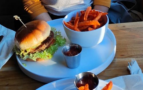 Impossible guacamole burger with sweet potato fries at Thomās Kitchen-Bar  in Juarez