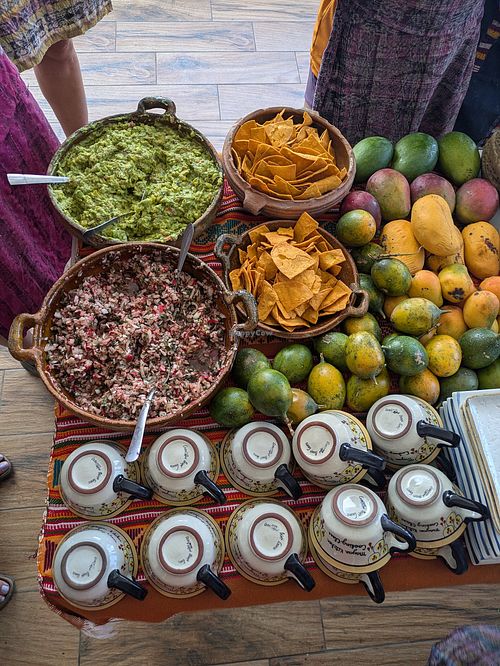 Appetizers: different mango varieties, exotic fruit, guacamole, radish salad at Anita's Mayan Kitchen Cooking Class in San Pedro La Laguna