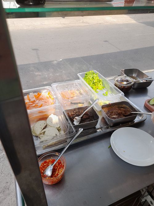 Banh mi stall with ingredients at HỒNG ÂN in Ho Chi Minh City