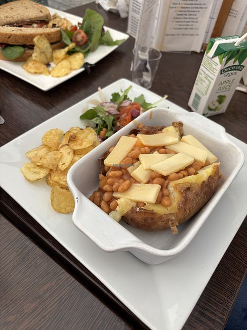 Baked potato with beans and vegan cheese   at Cafe Sorelle in Glasgow