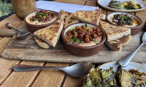 Hummus trio and grilled Brussels sprouts   at Ela in Atlanta