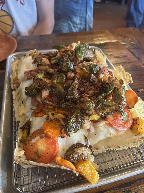 The Roots pizza with Vegan Cheese! Featured root veggies like squash, carrots, Brussel sprouts, & onion. The pizza dough is delicious and vegan cheese pretty good too!  at Bricks Corner in Salt Lake City