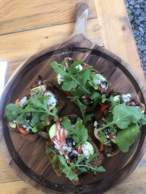 Gluten free pizza comes on gluten free bread. This one is the vegan pizza. Delicious!   at Love Probiotics in Tzununa