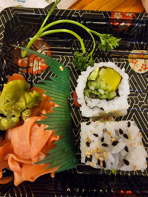 Vegetable roll (avocado, cucumber & pickled turnip, garnished with black & white sesame seeds)

Includes Wasabi & pickled pink ginger & soy sauce packet(soy sauce not pictured). at Kyo Ramen & Poke Bowl in Lombard