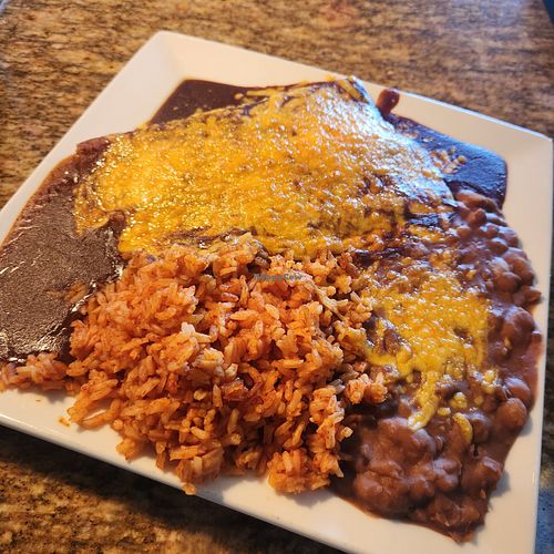 Two cheese and onion enchilada plate served with rice and beans. at Chiquita Rosita's in Barstow