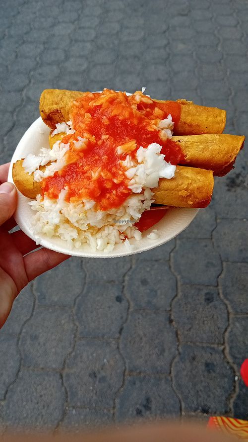 Tacos dorados de papas con repollo at Mercado Municipal in San Juan La Laguna