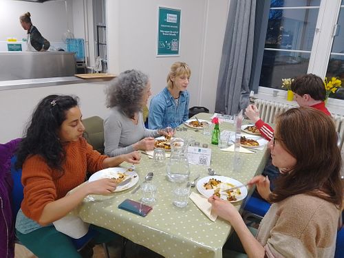 Group of diners enjoying their food and chatting. at Greener Kirkcaldy - Community Meal  in Kirkcaldy