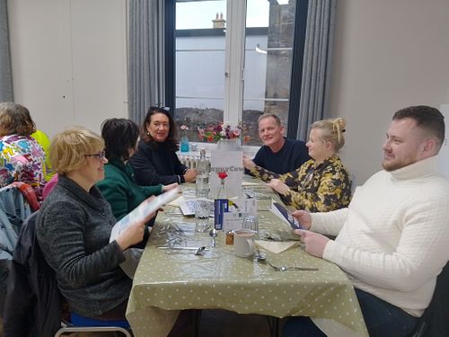 Group of diners reading the menu at Greener Kirkcaldy - Community Meal  in Kirkcaldy