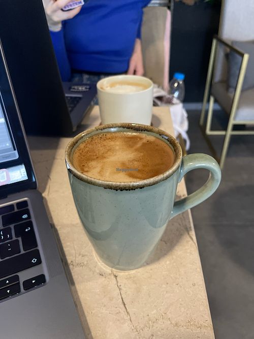 Flat white with oat milk   at Monique Cafe in Izmir