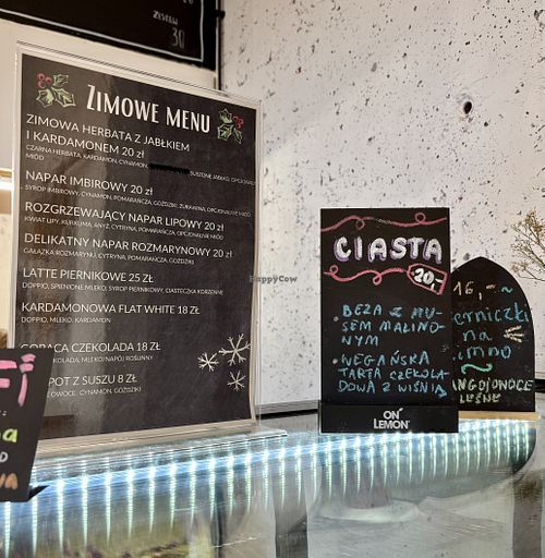 Winter hot beverages and vegan cake - chocolate cake tart with cherries (cakes every day are different - ask staff about them)  at Klubokawiarnia Ptaszyna in Warsaw