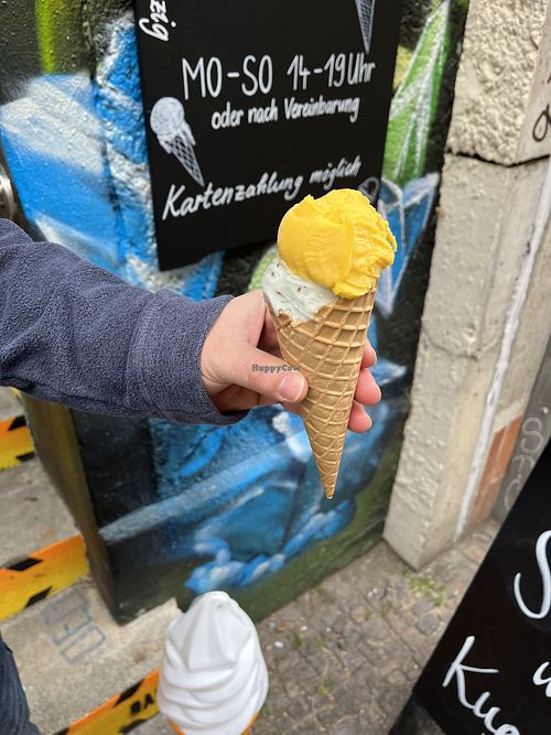 Mango + lime and basil scoops on a waffle cone  at Ice Kitchen in Leipzig