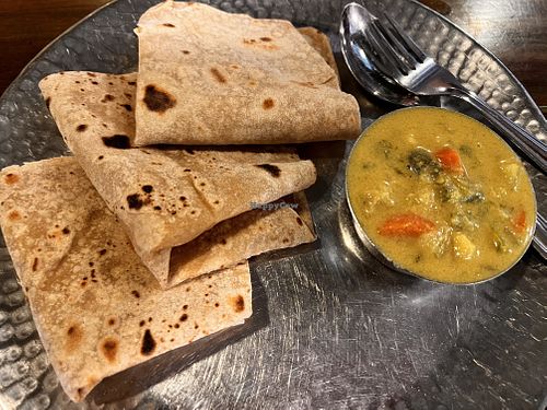 Lunchtime veg curry with 3 chapatis. 85 rupees. They give you extra curry if you need. You need! Lovely taste!  at Gokul Oottupura in Kochi
