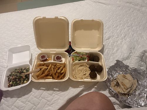 Tabbouleh, fries, hummus, falafel, and pita  at Ramallah - Gastropark in Managua