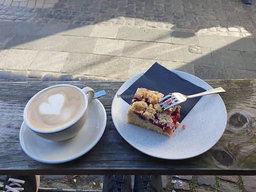 Cappuccino with oat milk & vegan cherry cake with crumbles at Marmalade Café & Bar   in Hamburg