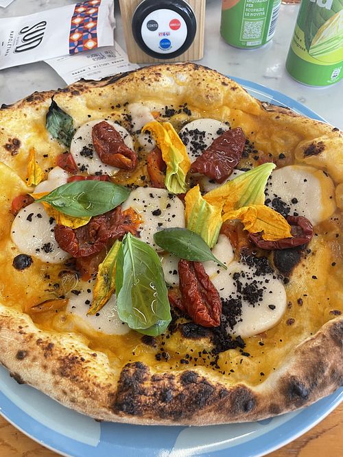 Vegetarian pizza with vegan cheese   at Sud in Riva Del Garda