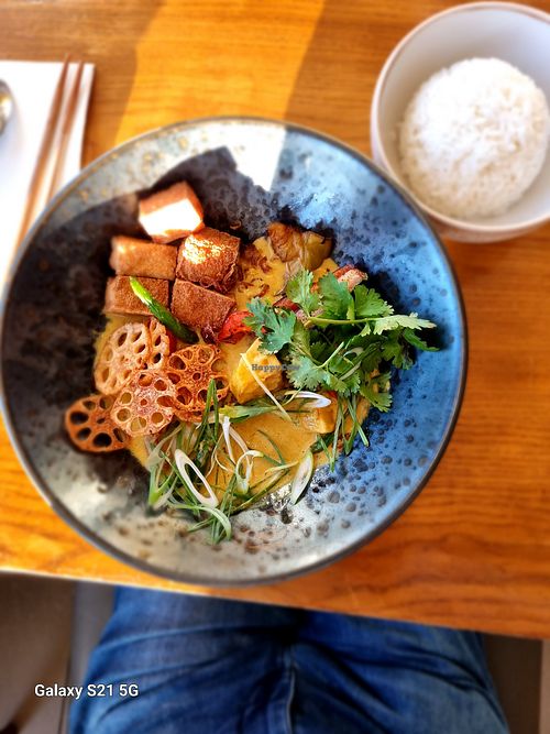 Yellow Curry with Lotus Chips and Crispy Tofu. at Pomelo Kitchen & Bar in Wellington