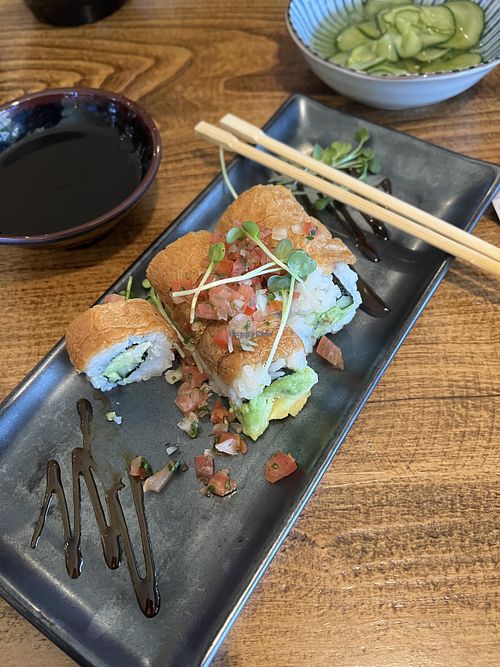 Saving Nemo roll. That is tofu skin on top. Sorry took a bite before taking the photo  at Mikuni   in Roseville