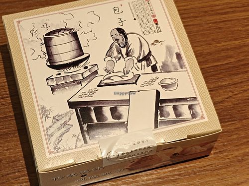 Steam pao in a takeaway box at Hermit's Cafe 尚隱植物料理 in Hangzhou