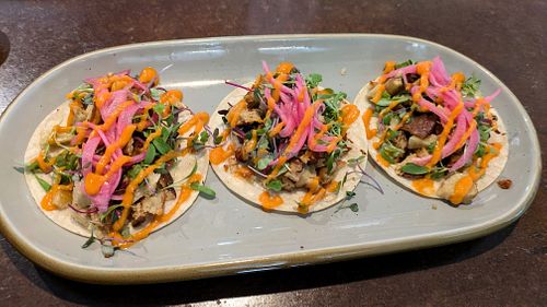 Blackbird Foods seitan tacos, pickled red onion, micro greens, and spicy creamy salsa roja. It's really hard to order anything else! at Vibrissa Beer  in Winchester