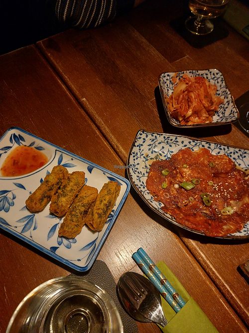 Appetizers (kimchi, kimchi pancakes, fried glass noodle rolls) at Restaurant Damoa in Marburg